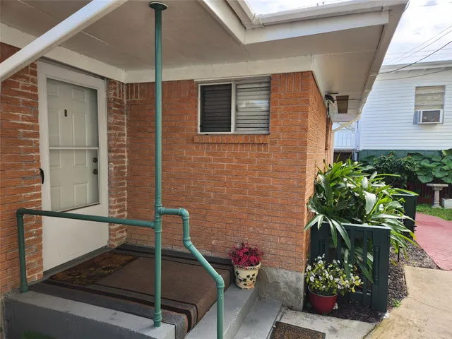 a view of backyard with a potted plant