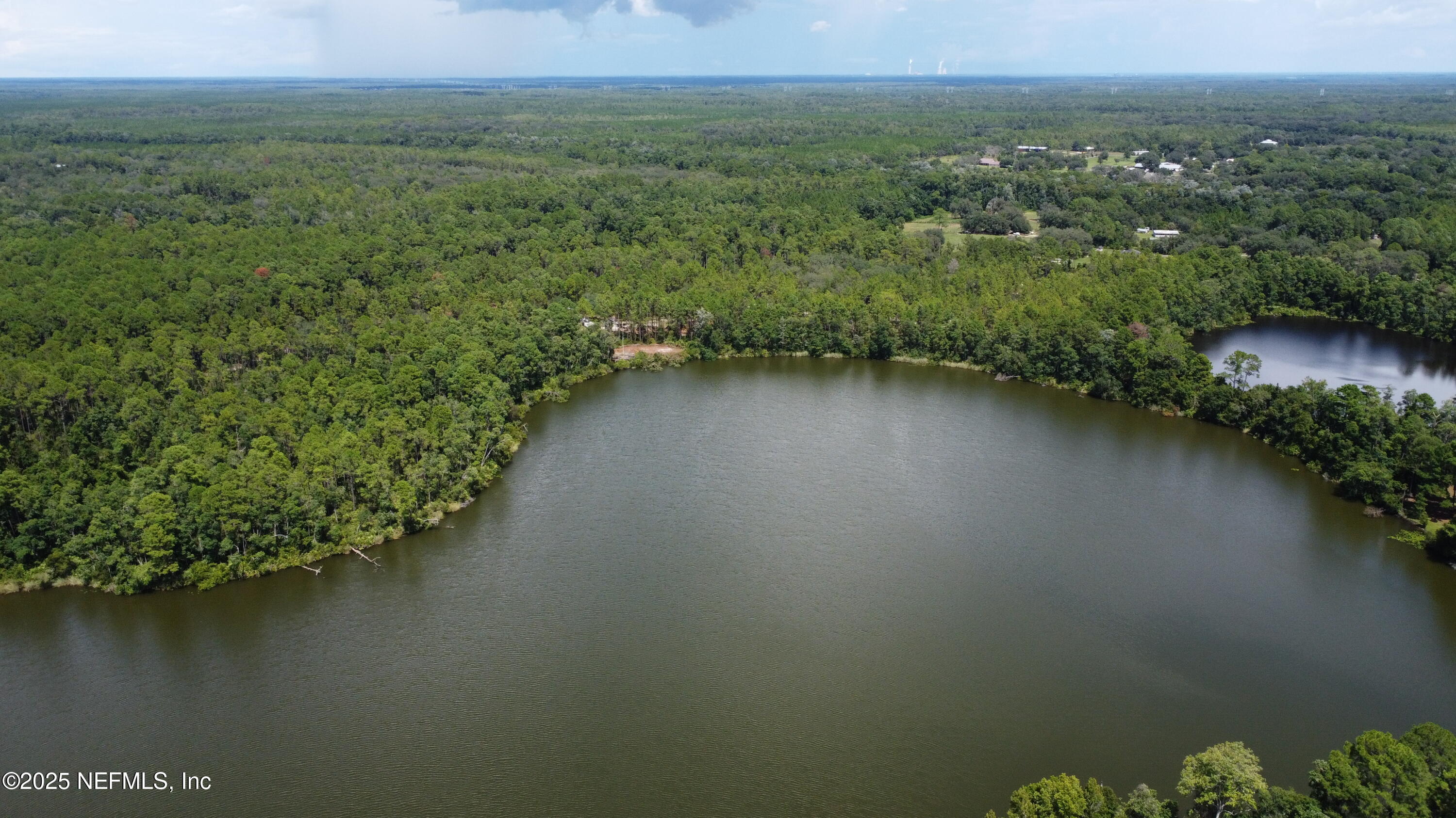 0 Britt Interlachen, FL 32148 - Photo 9 of 12 a view of a lake with a mountain in the back