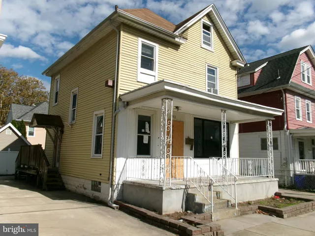 a front view of a house with glass windows