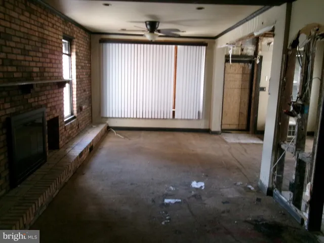 a view of livingroom with hardwood floor and a ceiling fan