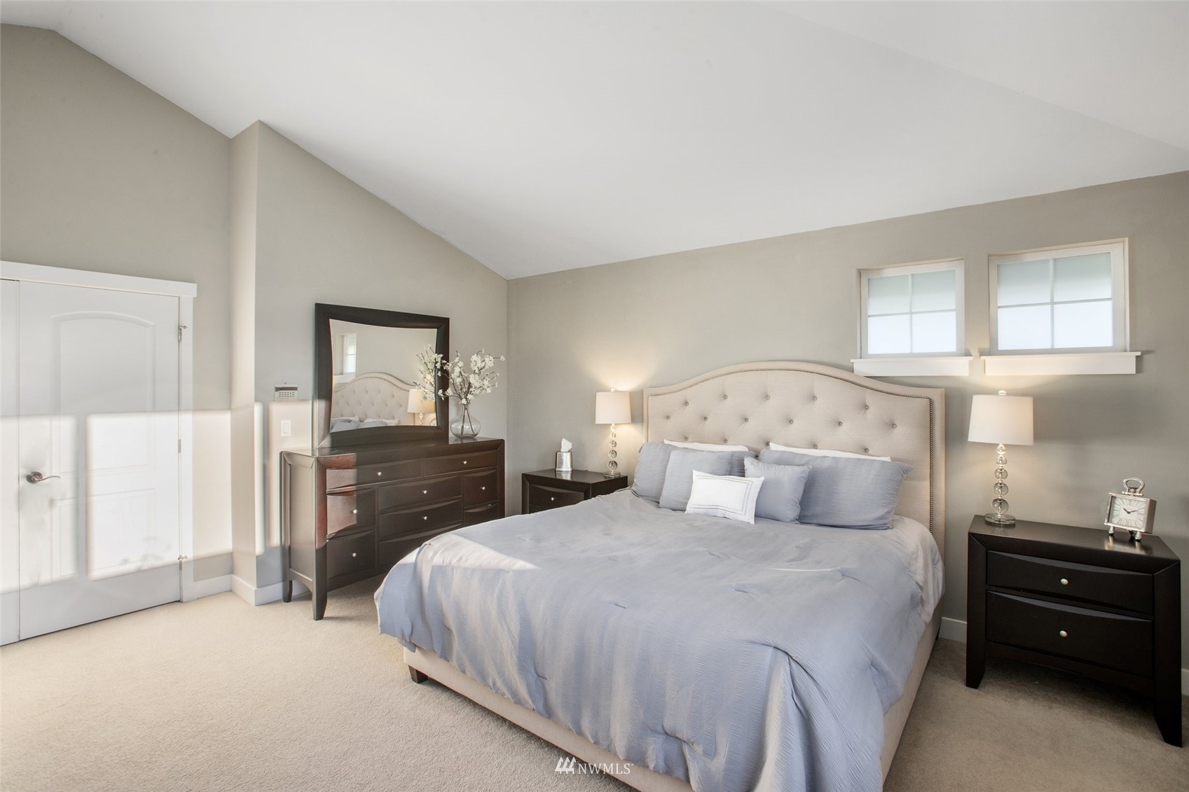 1328 North 39th Street Renton, WA 98056 - Photo 19 of 40 a bedroom with a bed and a chandelier