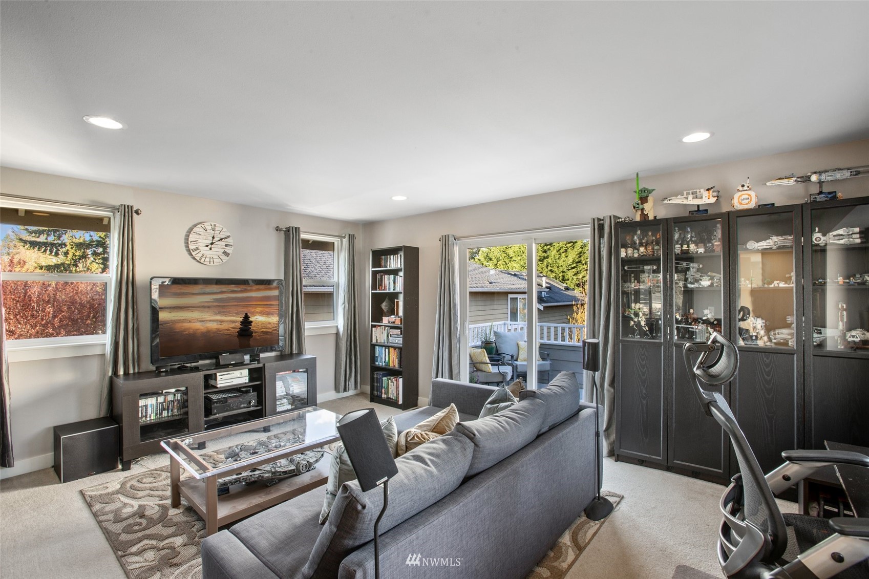 1328 North 39th Street Renton, WA 98056 - Photo 23 of 40 a living room with furniture and a flat screen tv