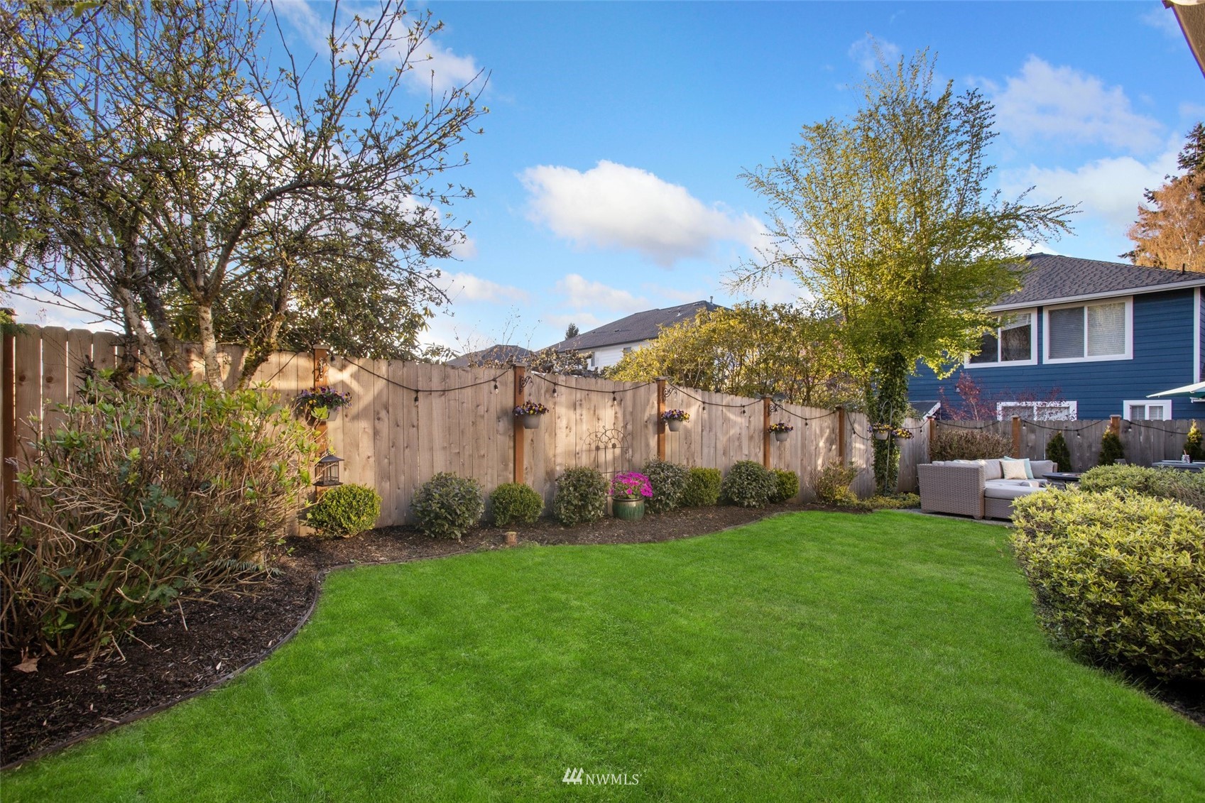 1328 North 39th Street Renton, WA 98056 - Photo 35 of 40 a view of a house with a back yard