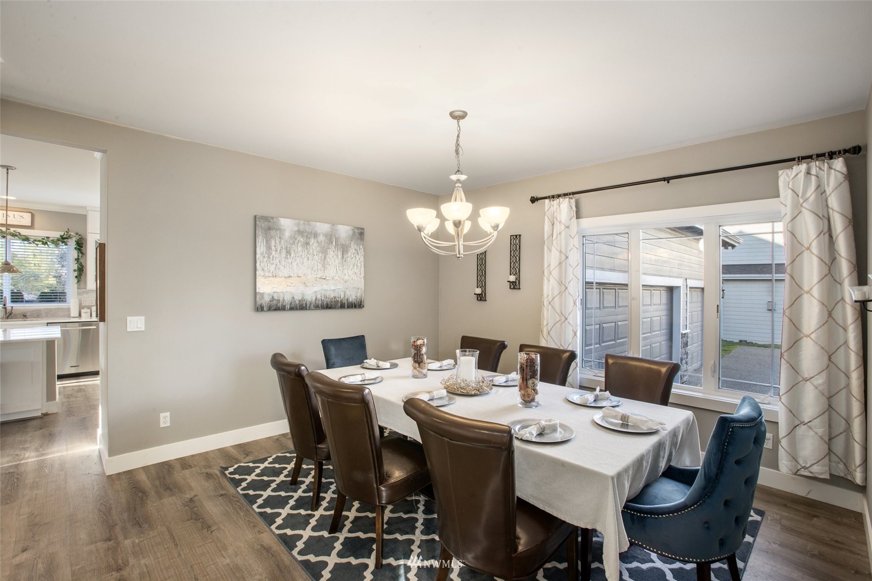 1328 North 39th Street Renton, WA 98056 - Photo 5 of 40 a view of a dining room with furniture wooden floor and chandelier