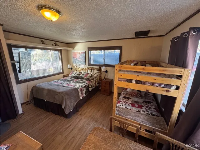 a bedroom with furniture and a window