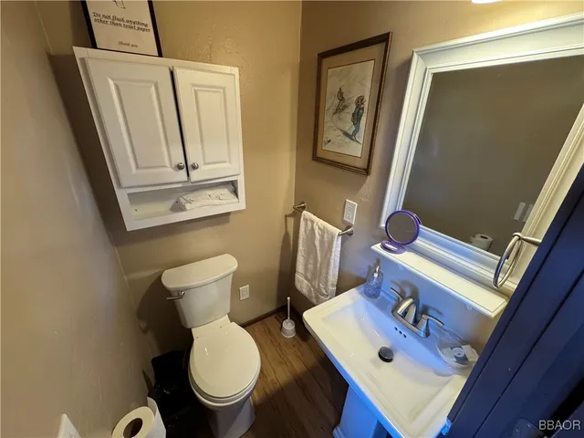 a view of balcony with wooden floor and fence