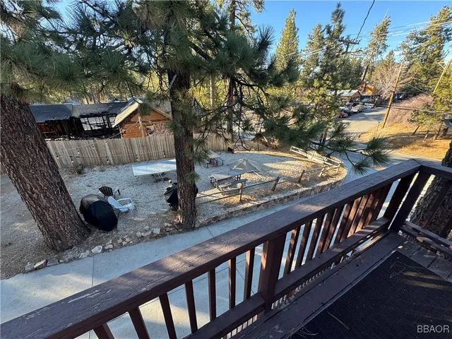 wooden floor with a bed in it