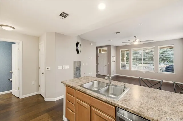 a kitchen with granite countertop a sink and a window