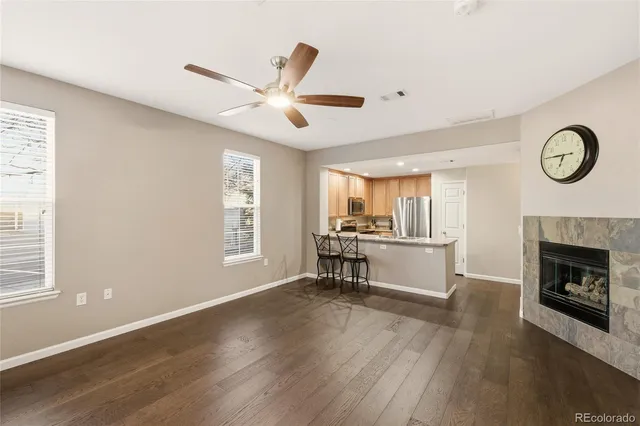 a view of living room with furniture and a fireplace