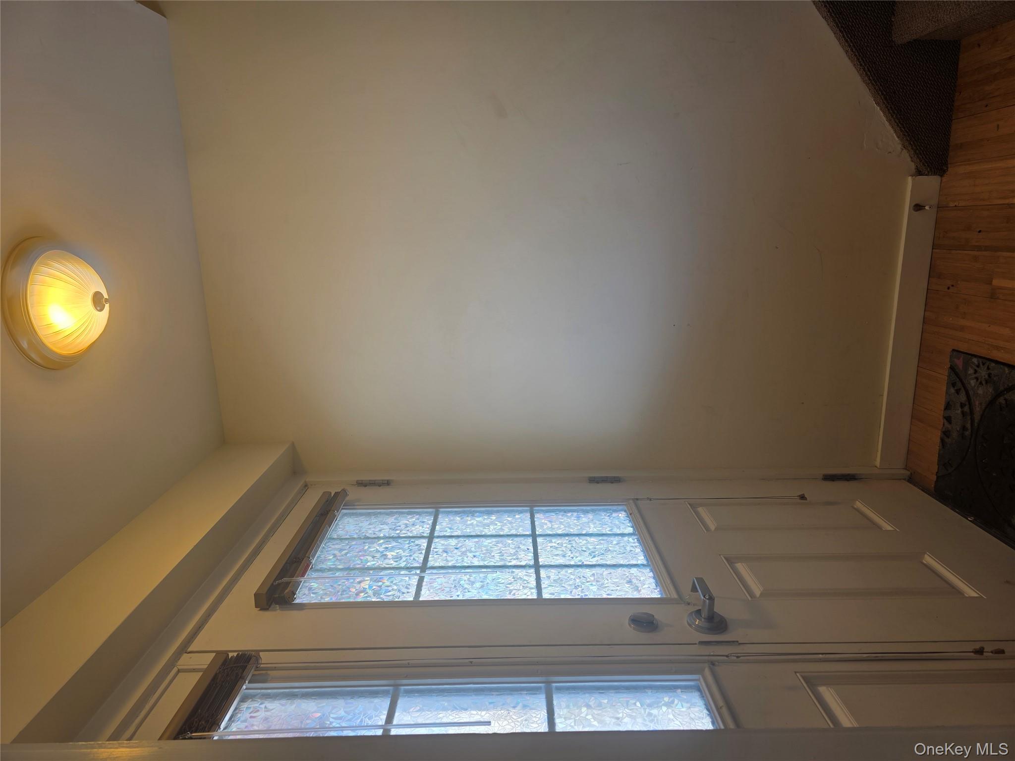 231 Reynolds Road, Unit 9 Fallsburg, NY 12759 - Photo 6 of 15 Entryway with baseboards and wood finished floors