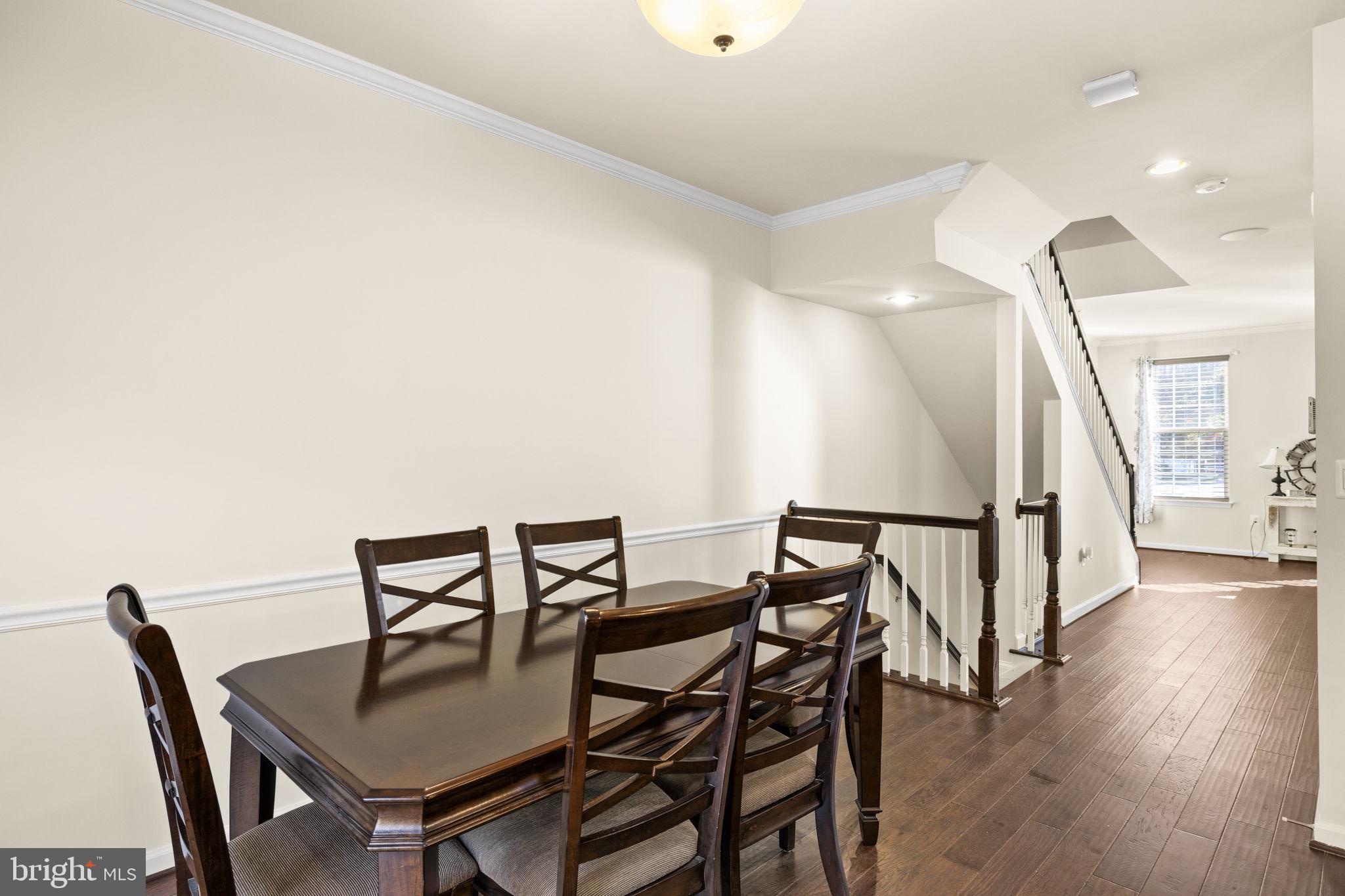 302 Tree Line Drive Fredericksburg, VA 22405 - Photo 16 of 38 a view of a dining room with furniture and wooden floor