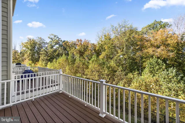 a view of a balcony with wooden floor