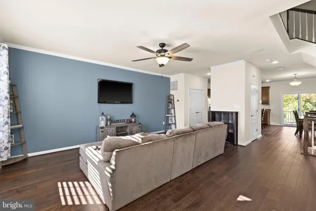 a living room with furniture fireplace and a flat screen tv