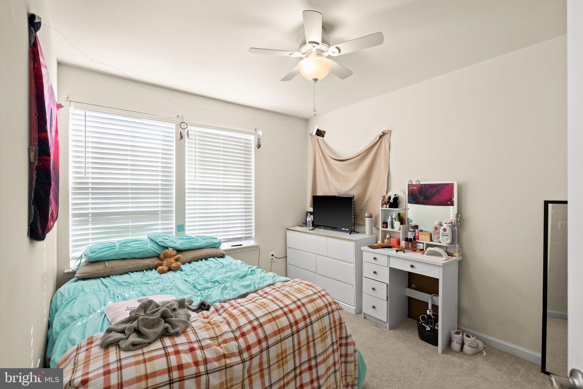 302 Tree Line Drive Fredericksburg, VA 22405 - Photo 30 of 38 a bedroom with a bed dresser and a window