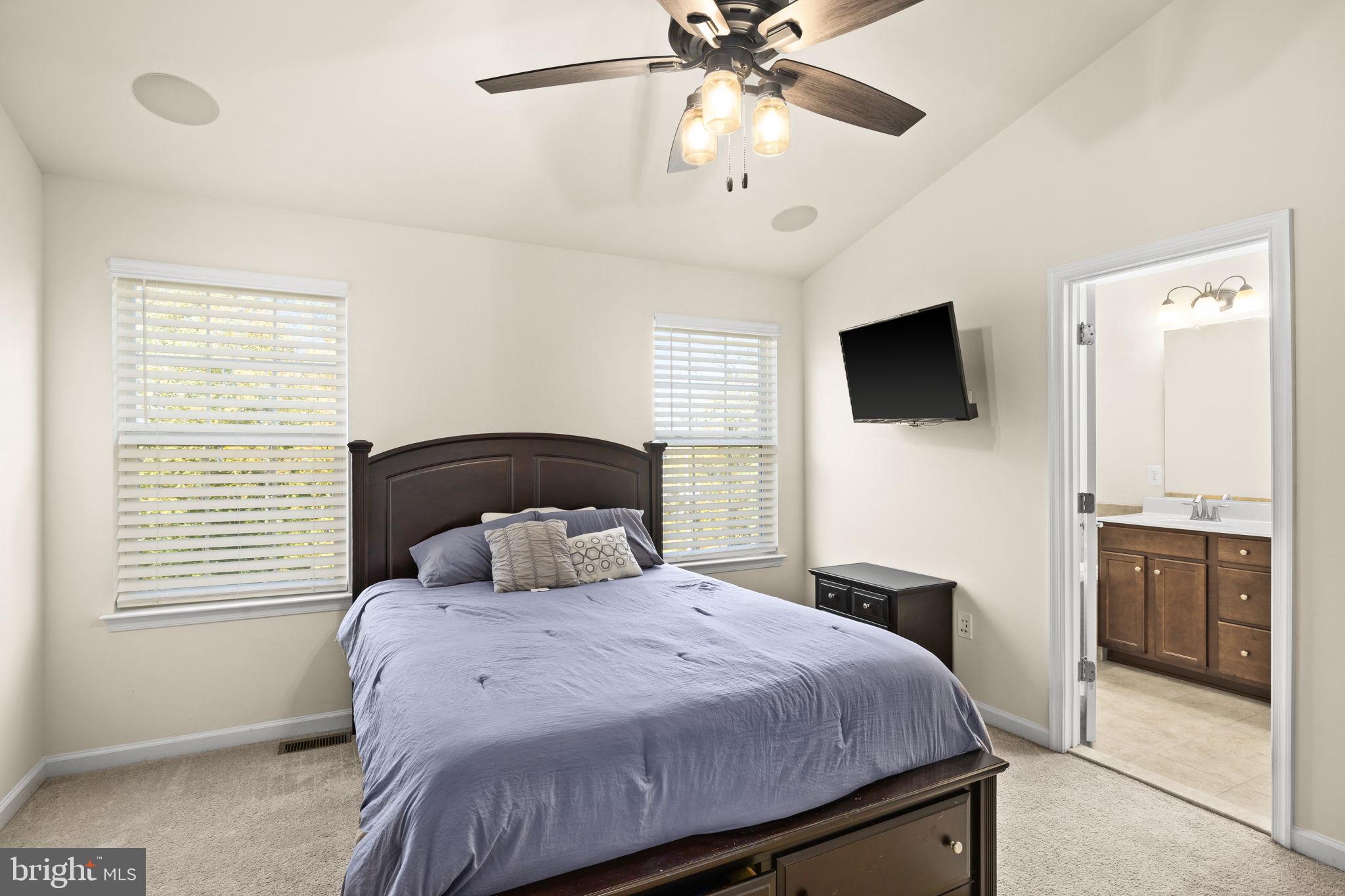 302 Tree Line Drive Fredericksburg, VA 22405 - Photo 33 of 38 a bedroom with a large bed and a flat screen tv