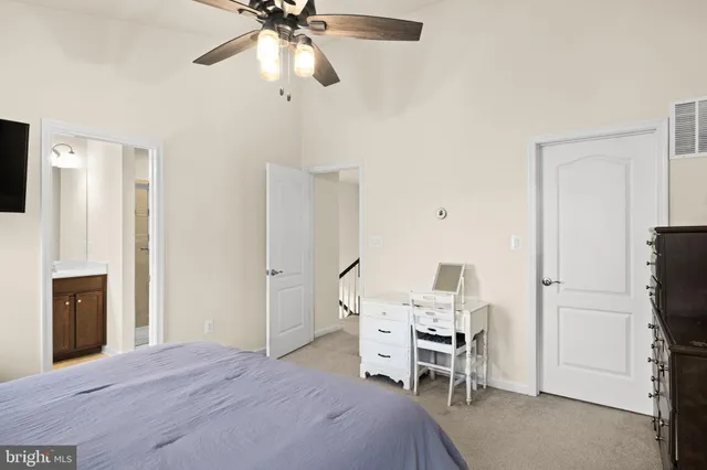 a bedroom with furniture and a fireplace