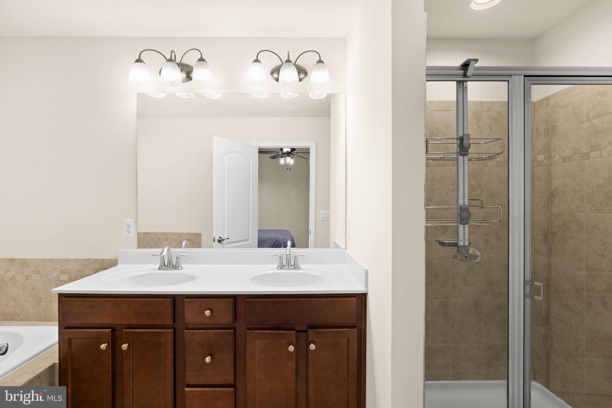 302 Tree Line Drive Fredericksburg, VA 22405 - Photo 35 of 38 a bathroom with a sink and a mirror