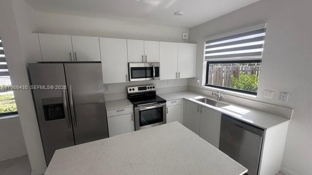 13300 Southwest 286th Street Homestead, FL 33033 - Photo 11 of 48 a kitchen with a refrigerator stove and sink