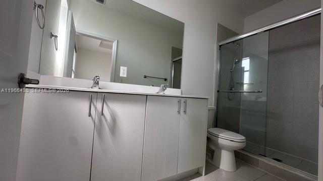13300 Southwest 286th Street Homestead, FL 33033 - Photo 20 of 48 a bathroom with a toilet sink and shower