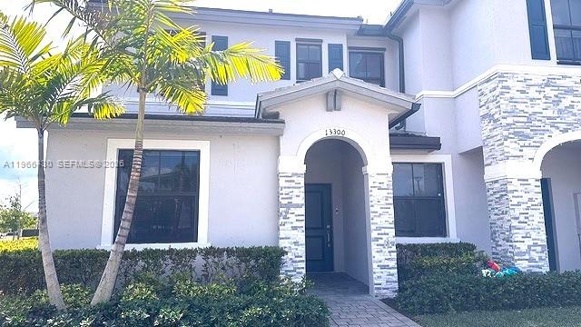 13300 Southwest 286th Street Homestead, FL 33033 - Photo 2 of 48 a front view of a house with a yard