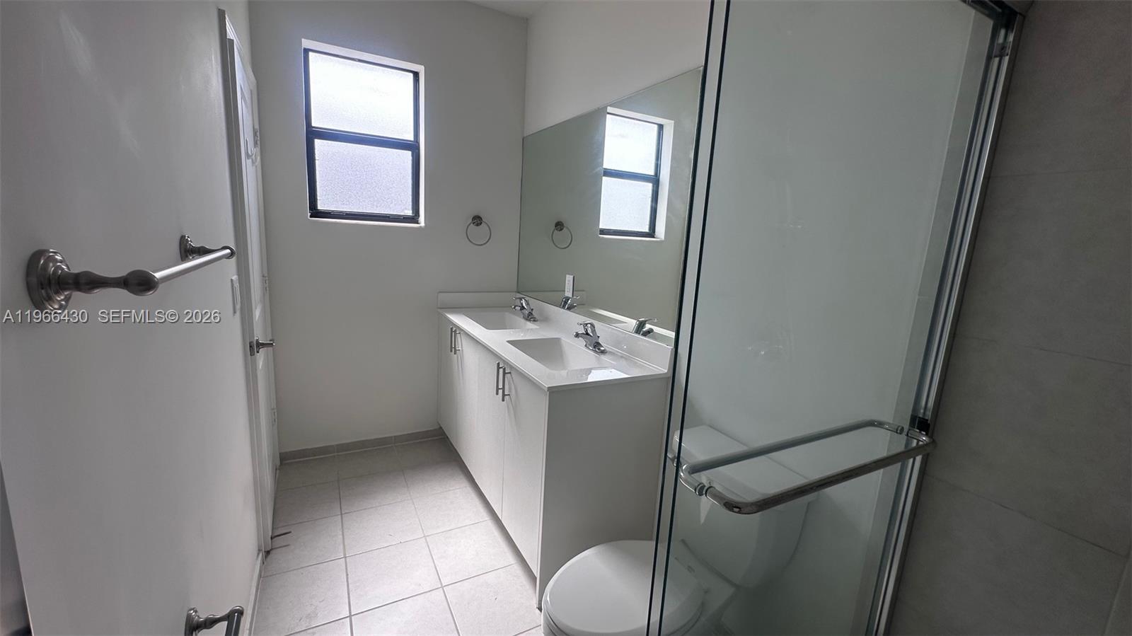 13300 Southwest 286th Street Homestead, FL 33033 - Photo 21 of 48 a bathroom with a sink toilet and shower