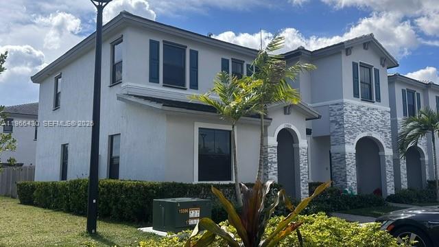 13300 Southwest 286th Street Homestead, FL 33033 - Photo 32 of 48 a front view of a house with lots of yellow lighting