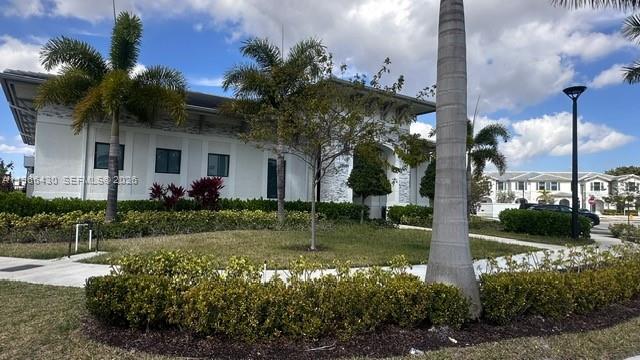 13300 Southwest 286th Street Homestead, FL 33033 - Photo 33 of 48 a front view of a house with garden