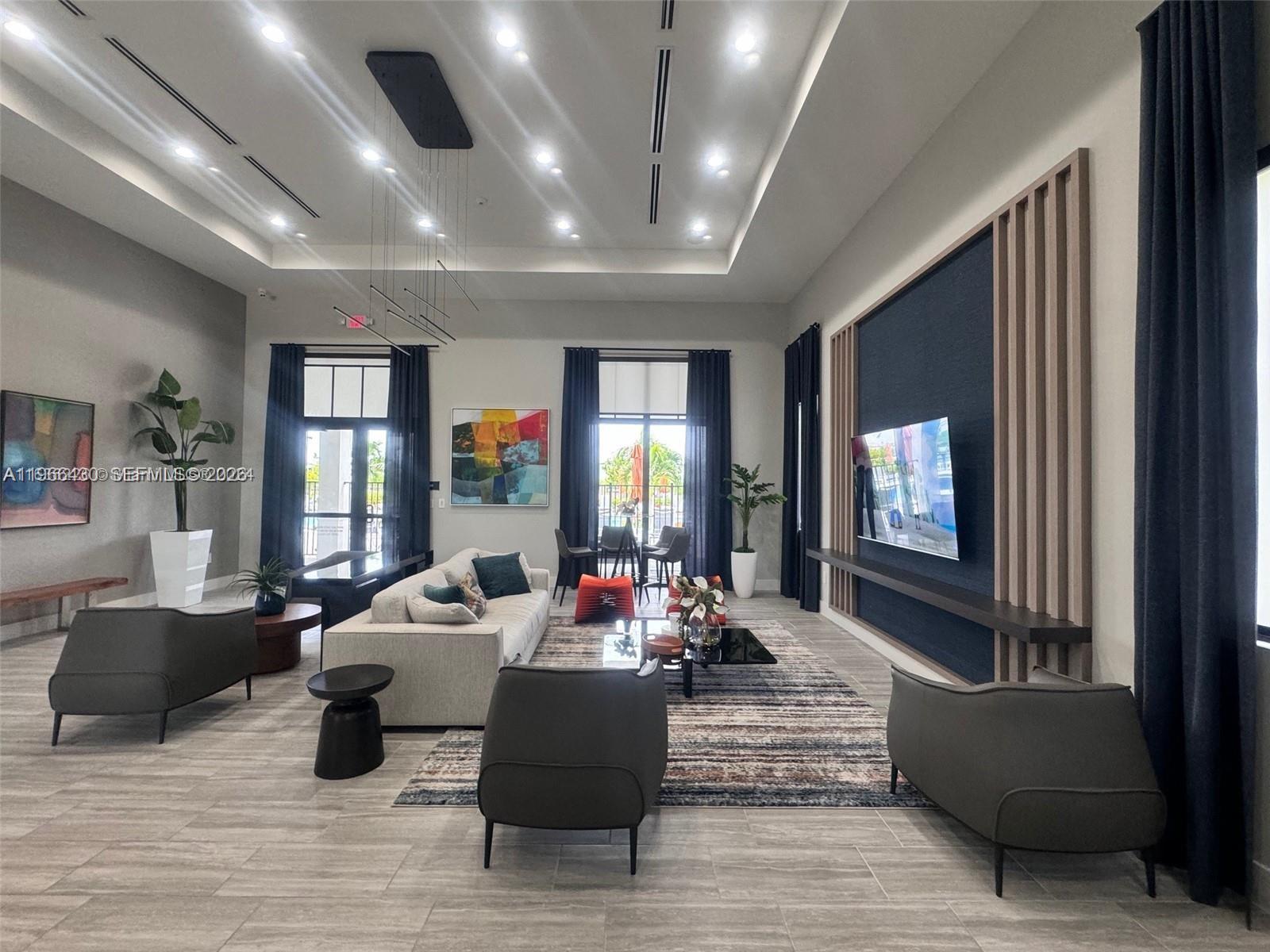 13300 Southwest 286th Street Homestead, FL 33033 - Photo 36 of 48 a living room with furniture large window and wooden floor