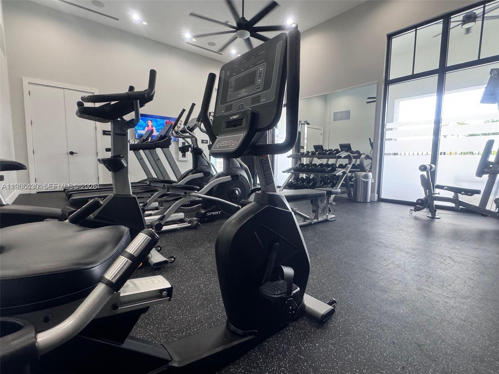 13300 Southwest 286th Street Homestead, FL 33033 - Photo 38 of 48 a room with gym equipment and a large window