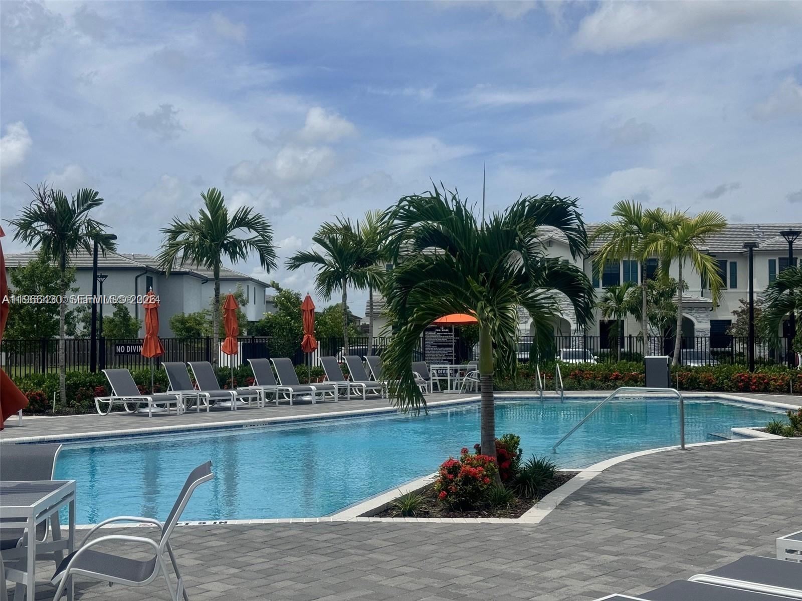 13300 Southwest 286th Street Homestead, FL 33033 - Photo 39 of 48 a swimming pool with outdoor seating and yard