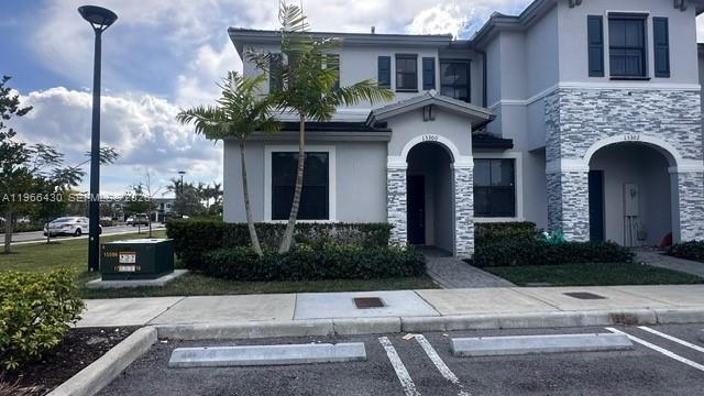 13300 Southwest 286th Street Homestead, FL 33033 - Photo 44 of 48 a front view of a house with garden