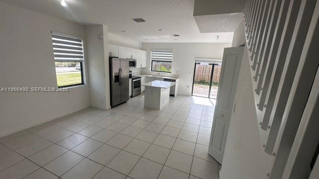13300 Southwest 286th Street Homestead, FL 33033 - Photo 8 of 48 a view of a kitchen with fridge and windows