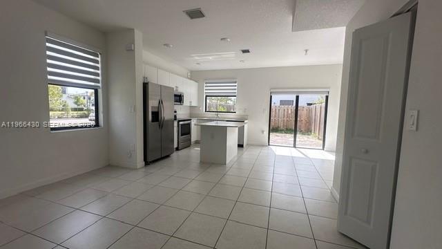 13300 Southwest 286th Street Homestead, FL 33033 - Photo 9 of 48 a view of a kitchen with an empty space and window
