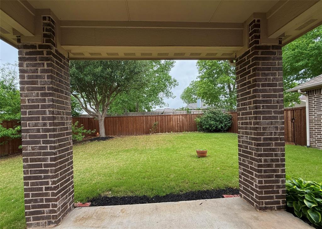12809 Spring Hill Drive Frisco, TX 75035 - Photo 6 of 37 a view of a backyard with a garden
