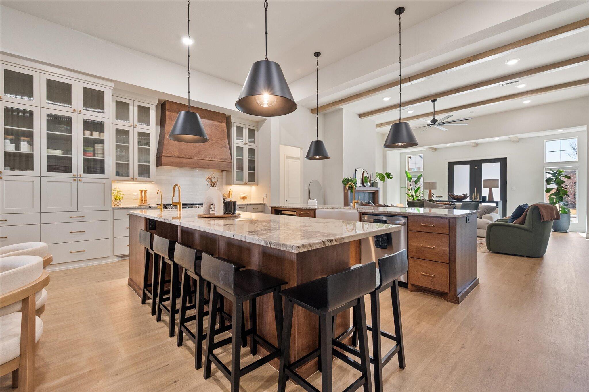 4026 136th Street Lubbock, TX 79423 - Photo 11 of 40 a kitchen with a dining table chairs and wooden floor