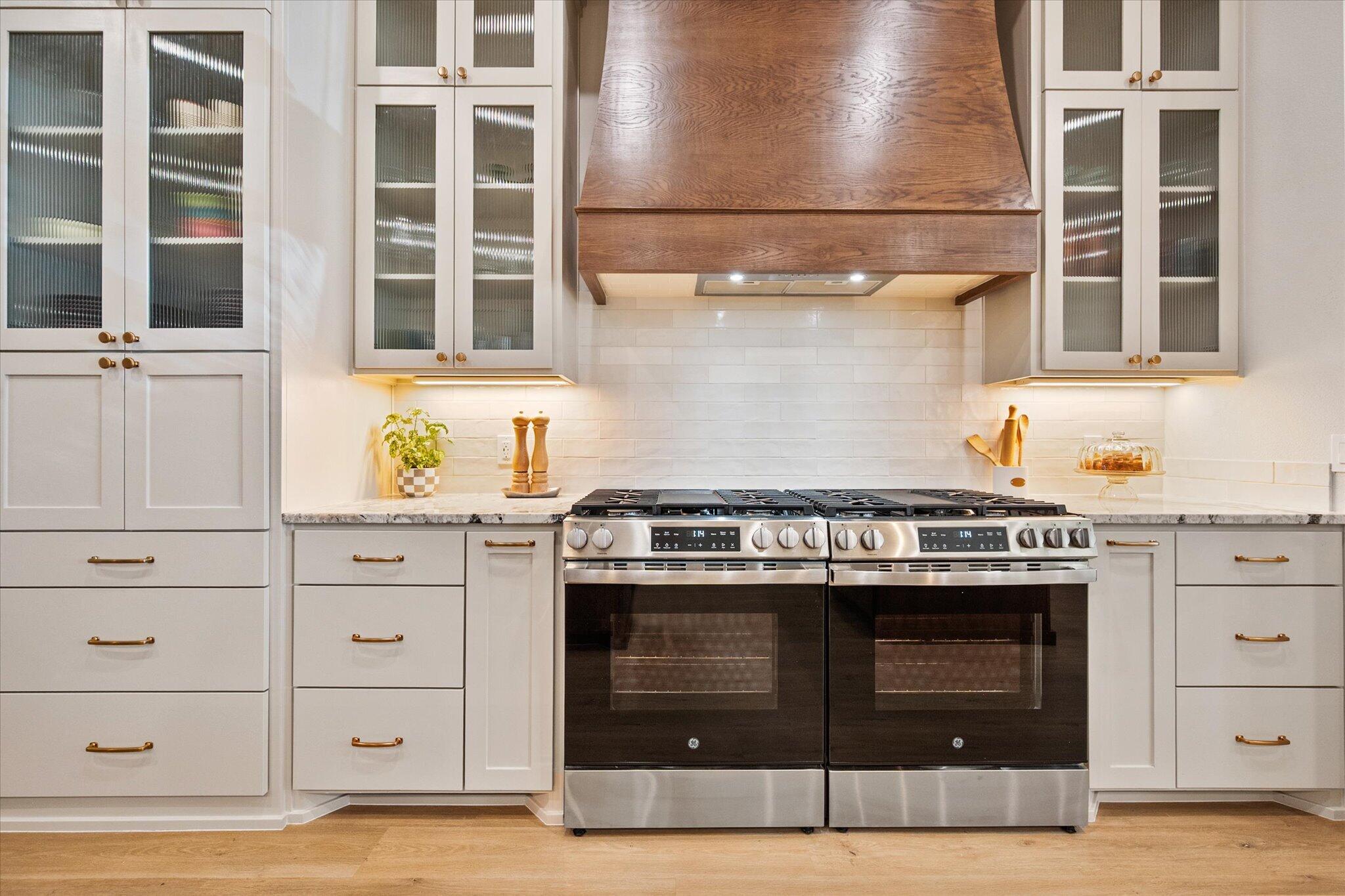 4026 136th Street Lubbock, TX 79423 - Photo 12 of 40 a kitchen with stainless steel appliances granite countertop a stove and a refrigerator