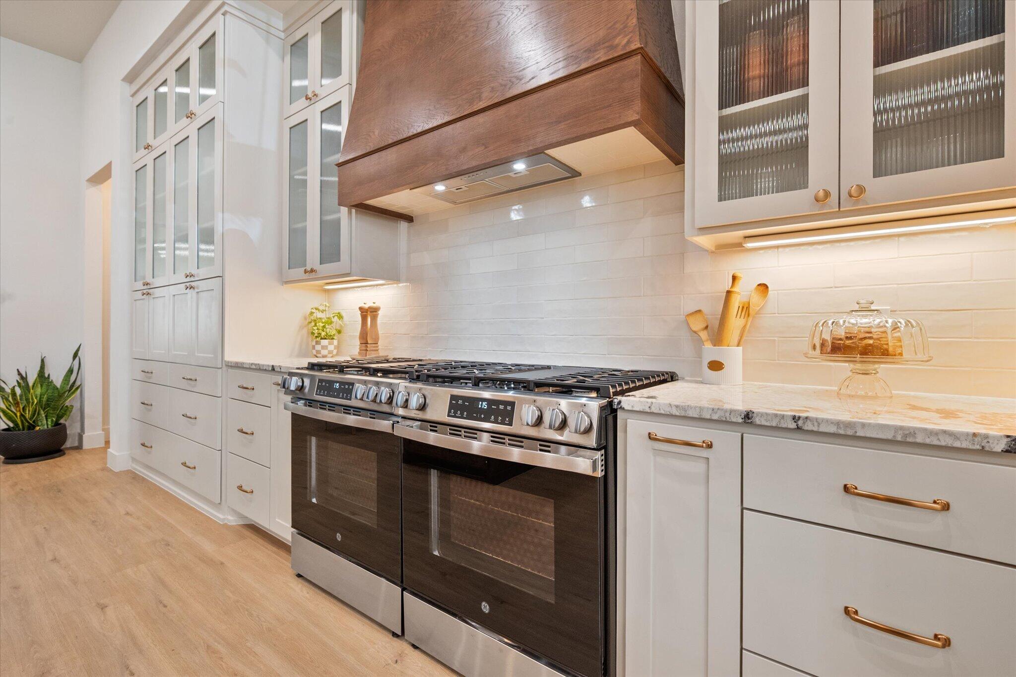 4026 136th Street Lubbock, TX 79423 - Photo 13 of 40 a kitchen with stainless steel appliances granite countertop a stove and a sink