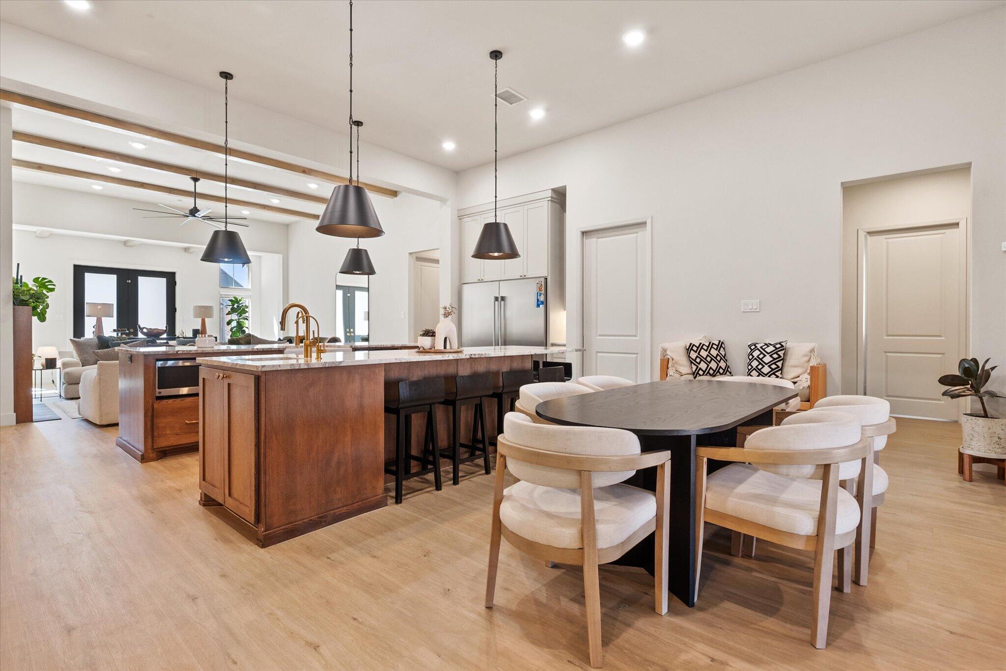 4026 136th Street Lubbock, TX 79423 - Photo 16 of 40 a kitchen with a table and chairs in it
