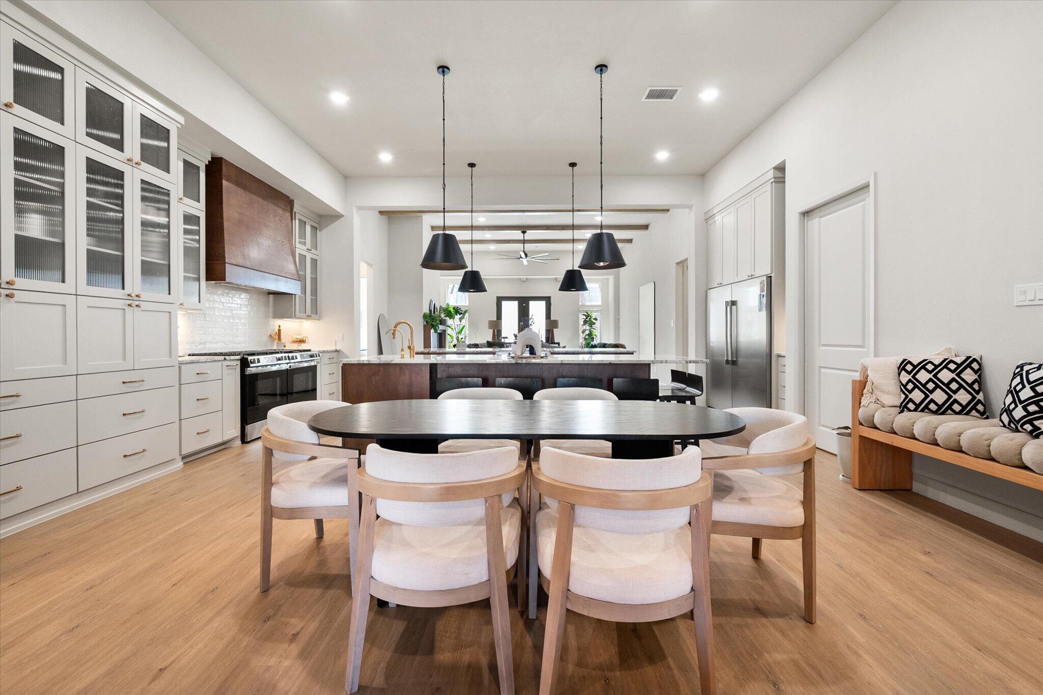 4026 136th Street Lubbock, TX 79423 - Photo 17 of 40 a view of a dining room with furniture and wooden floor
