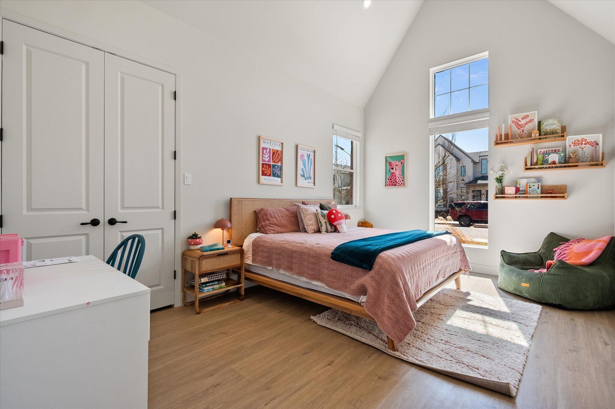 4026 136th Street Lubbock, TX 79423 - Photo 20 of 40 a bedroom with a bed and a couch