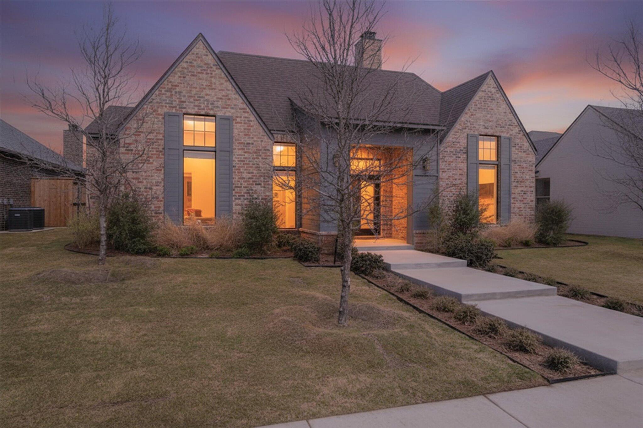 4026 136th Street Lubbock, TX 79423 - Photo 2 of 40 a front view of a house with a yard