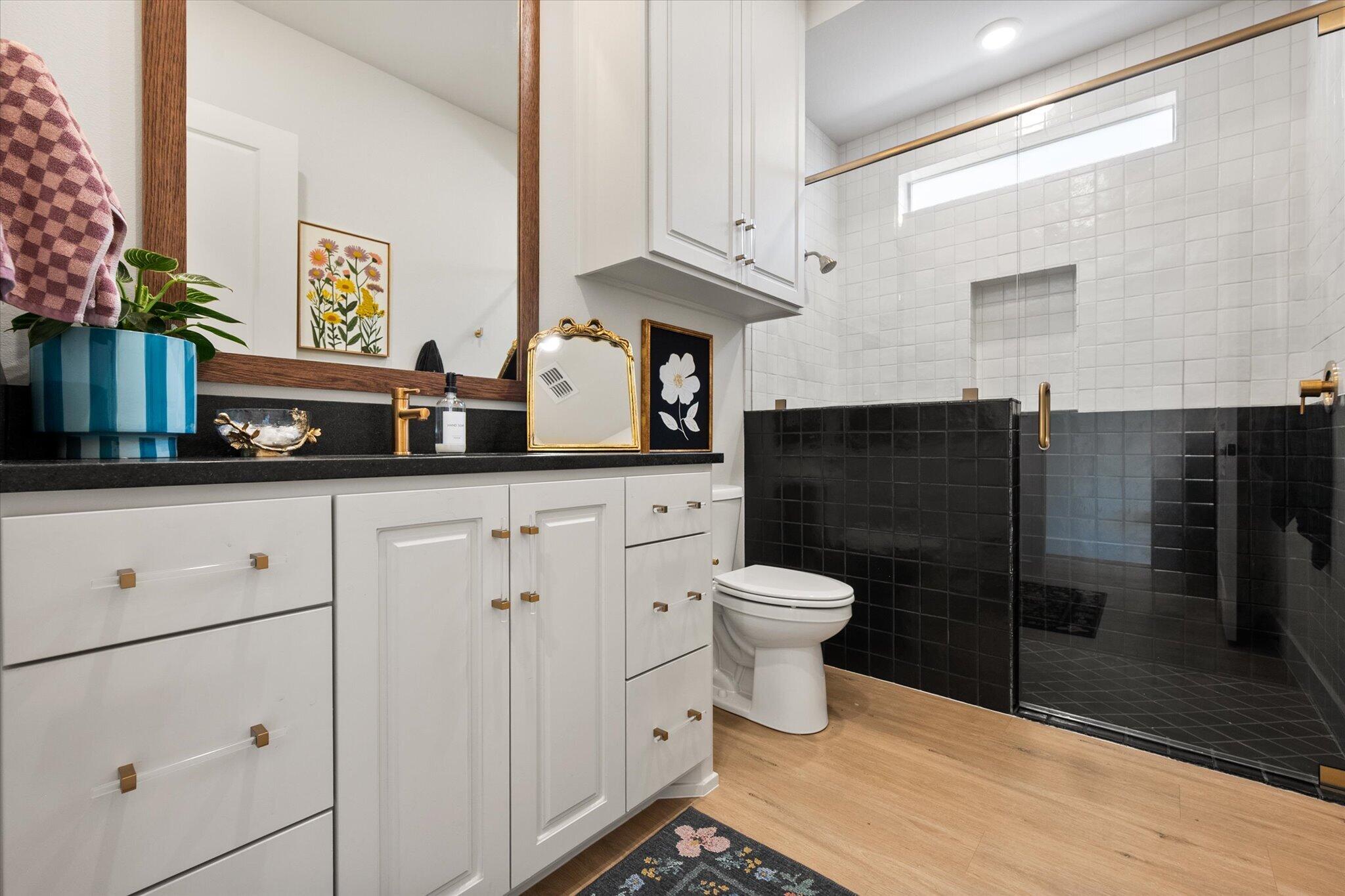 4026 136th Street Lubbock, TX 79423 - Photo 21 of 40 a bathroom with a toilet sink and shower