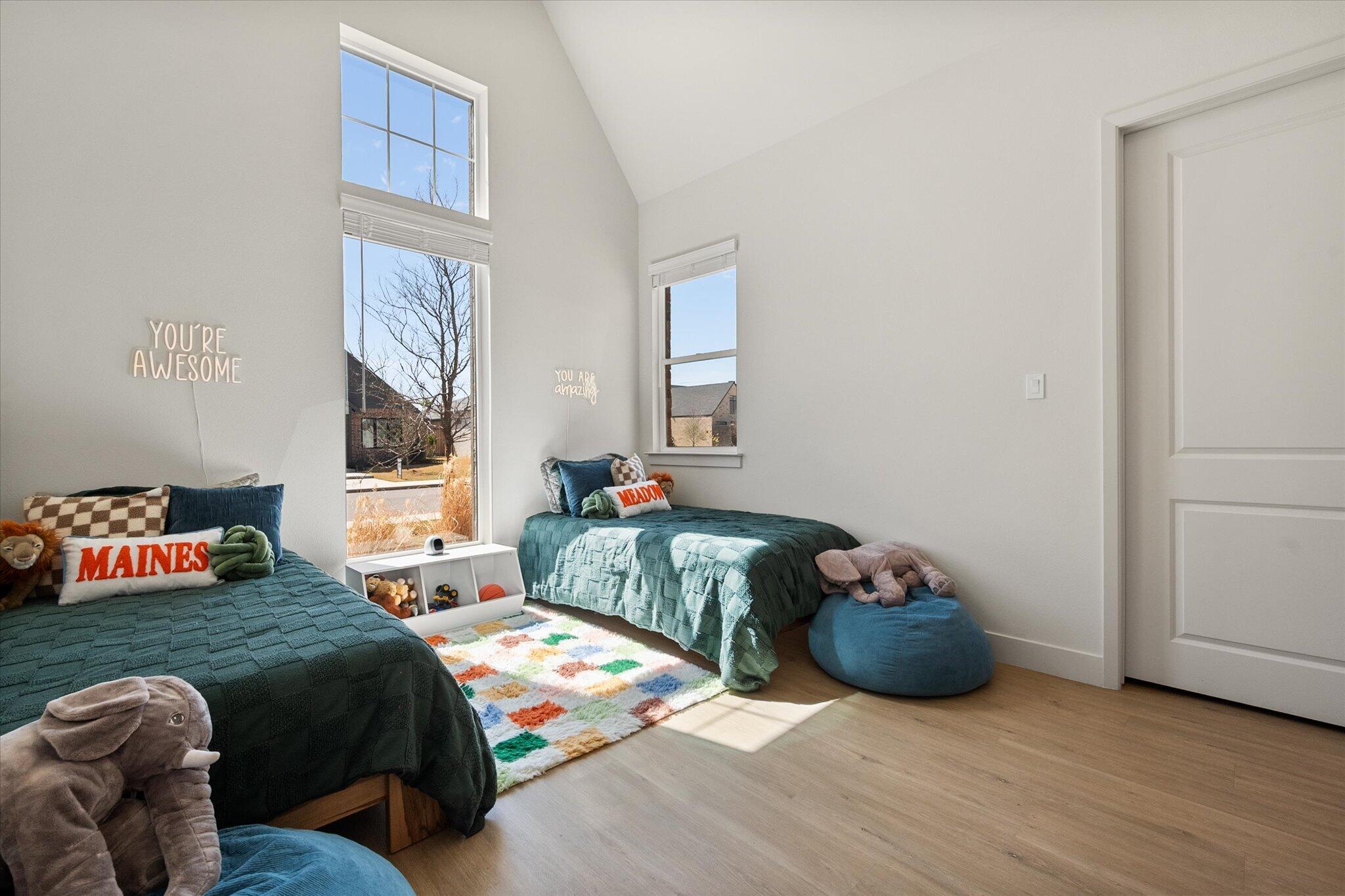 4026 136th Street Lubbock, TX 79423 - Photo 22 of 40 a bedroom with a bed and a window