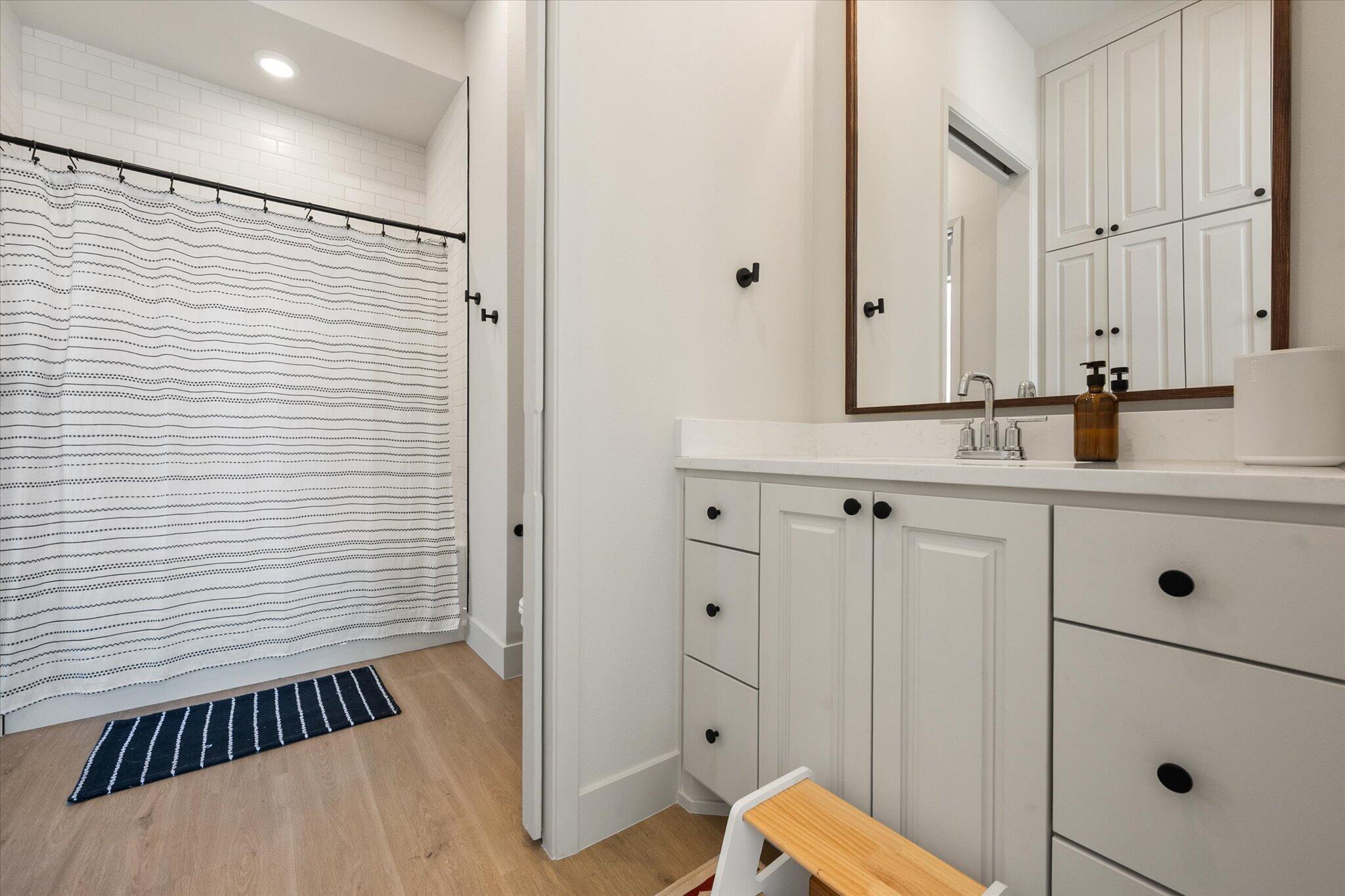 4026 136th Street Lubbock, TX 79423 - Photo 23 of 40 a bathroom with a sink and a mirror