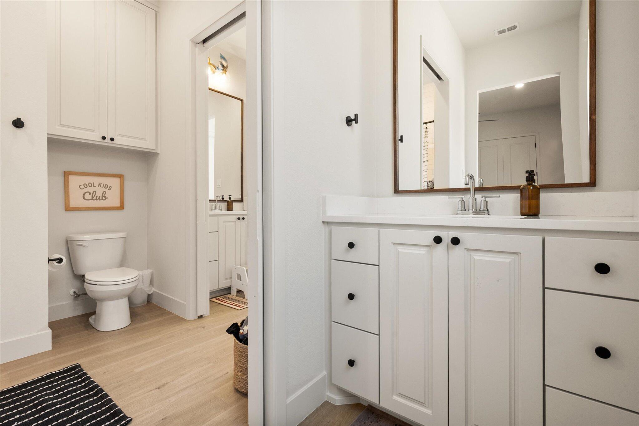 4026 136th Street Lubbock, TX 79423 - Photo 24 of 40 a bathroom with a sink and a mirror