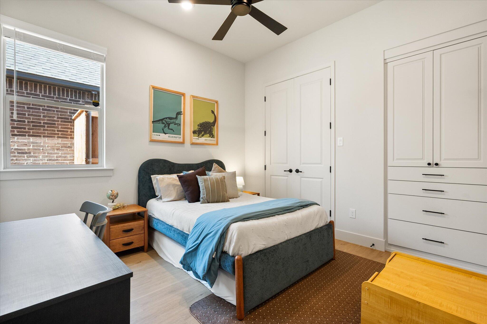 4026 136th Street Lubbock, TX 79423 - Photo 25 of 40 a bedroom with a bed and wooden floor