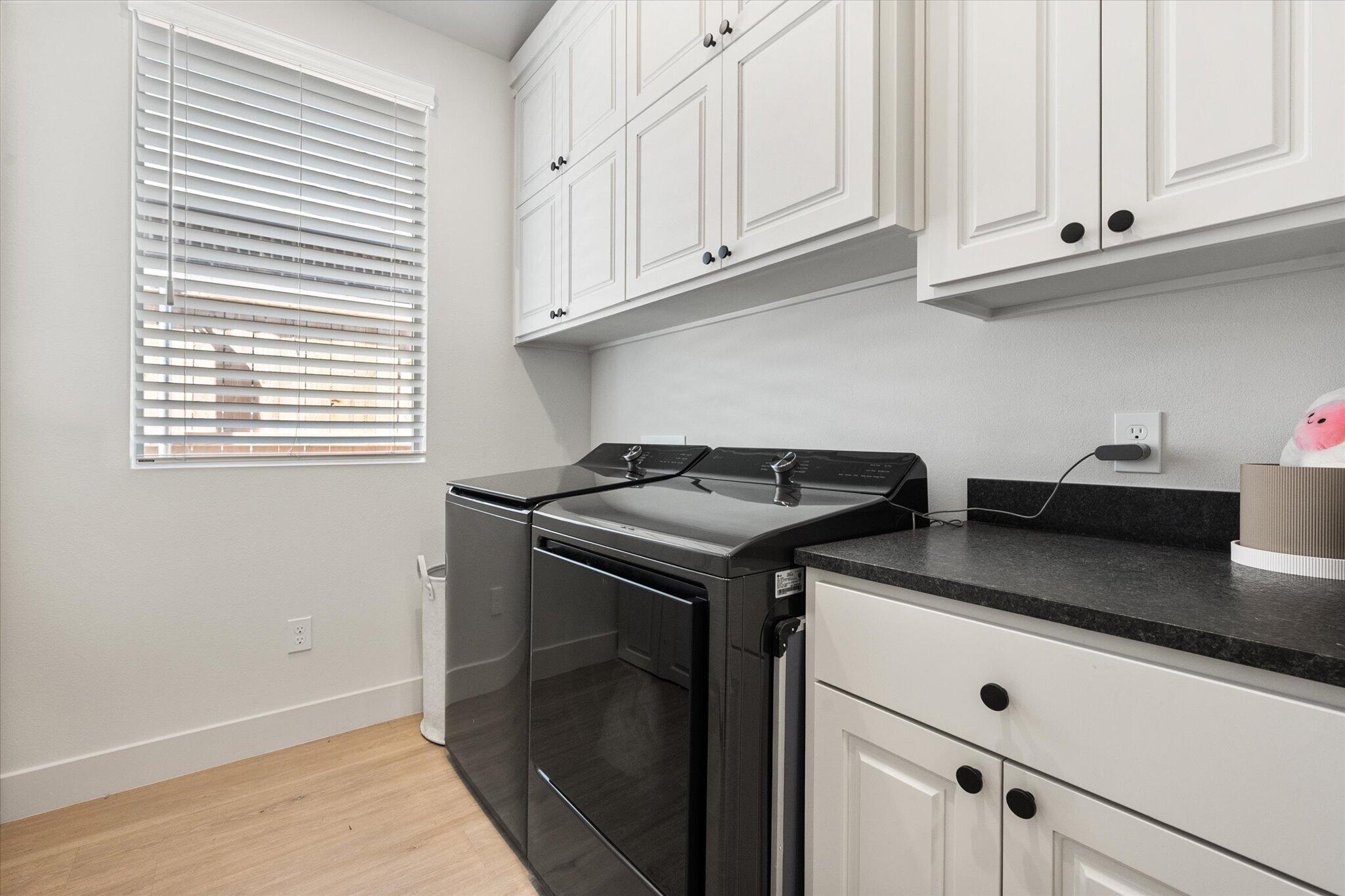 4026 136th Street Lubbock, TX 79423 - Photo 28 of 40 a kitchen with stainless steel appliances granite countertop white cabinets and a stove