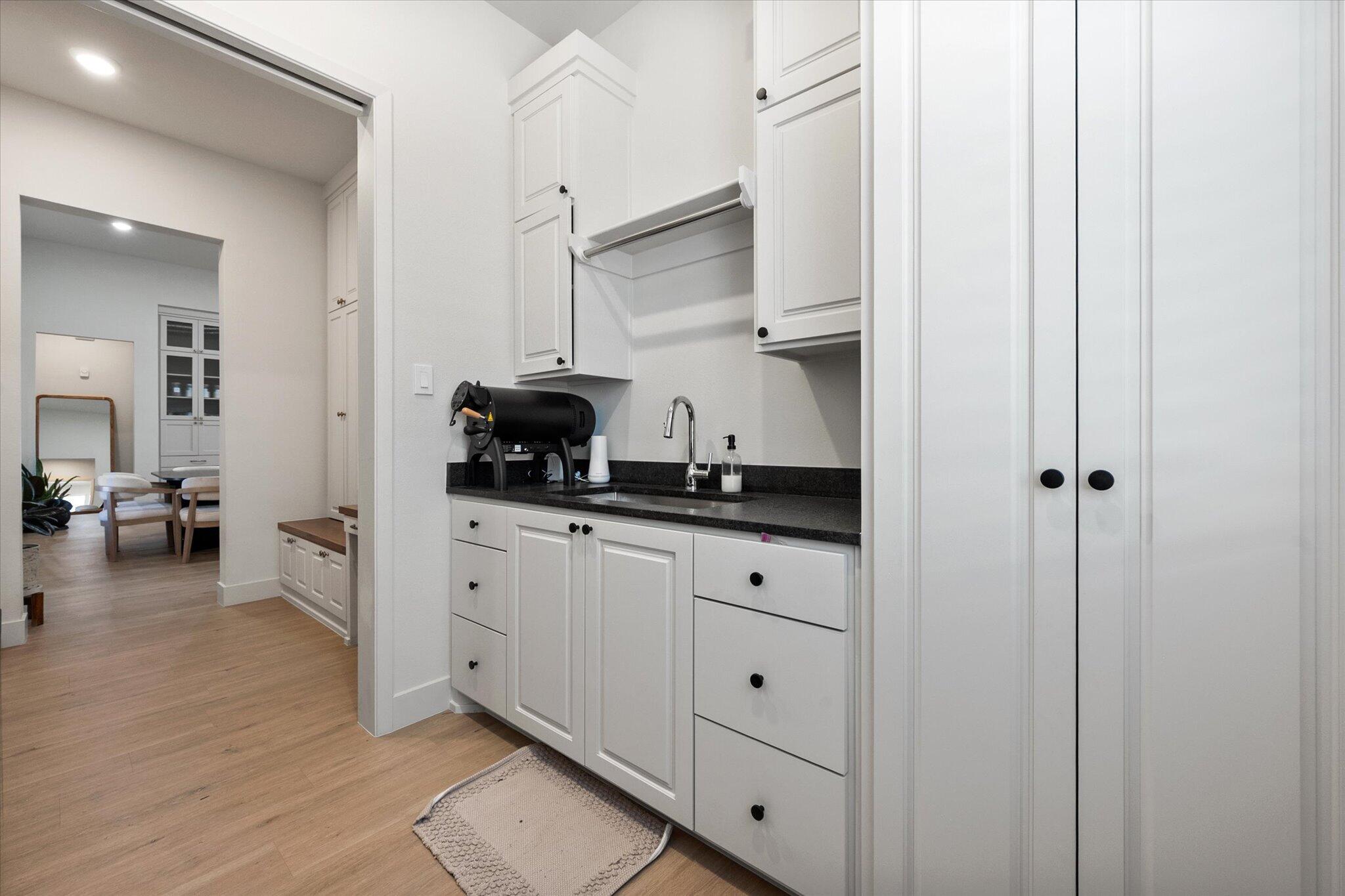 4026 136th Street Lubbock, TX 79423 - Photo 29 of 40 a kitchen with white cabinets and appliances