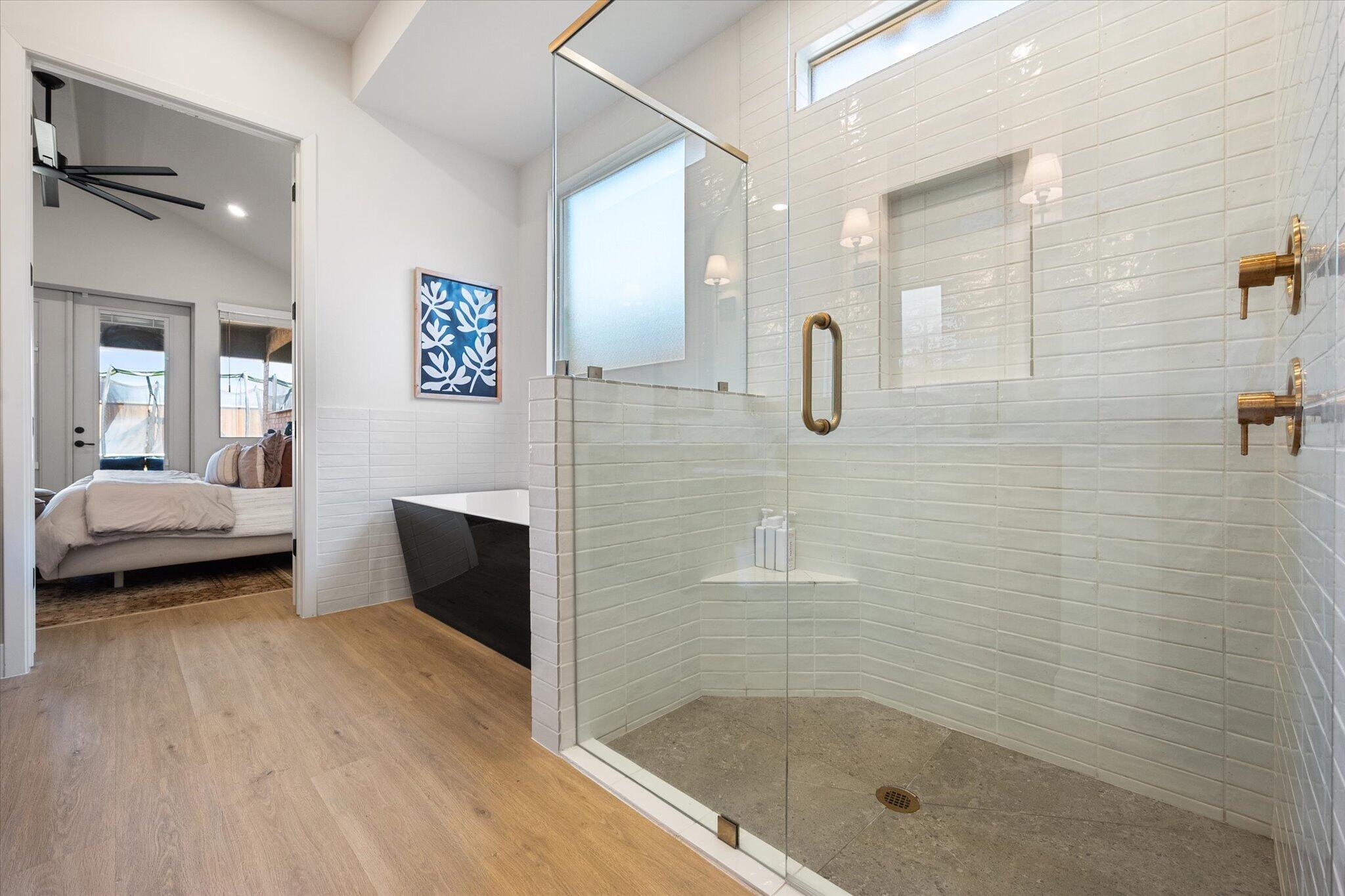 4026 136th Street Lubbock, TX 79423 - Photo 35 of 40 a bathroom with a glass shower door