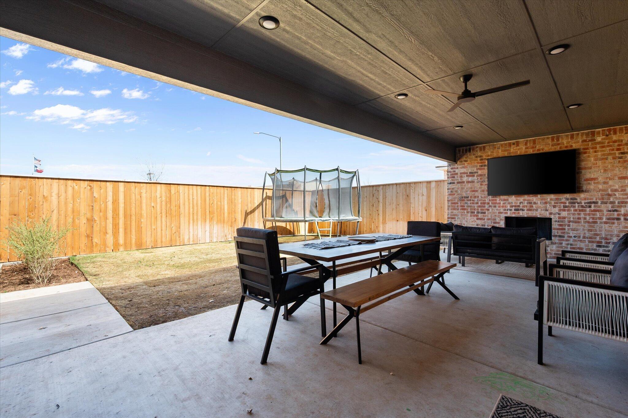 4026 136th Street Lubbock, TX 79423 - Photo 37 of 40 a backyard of a house with table and chairs